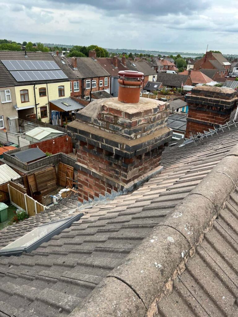 This is a photo taken from a roof which is being repaired by Halesowen Roofing Repairs, it shows a street of houses, and their roofs